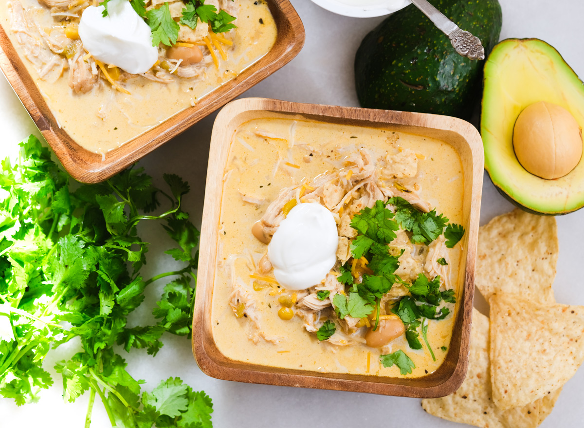 white chicken chili in two bowls with cilantro